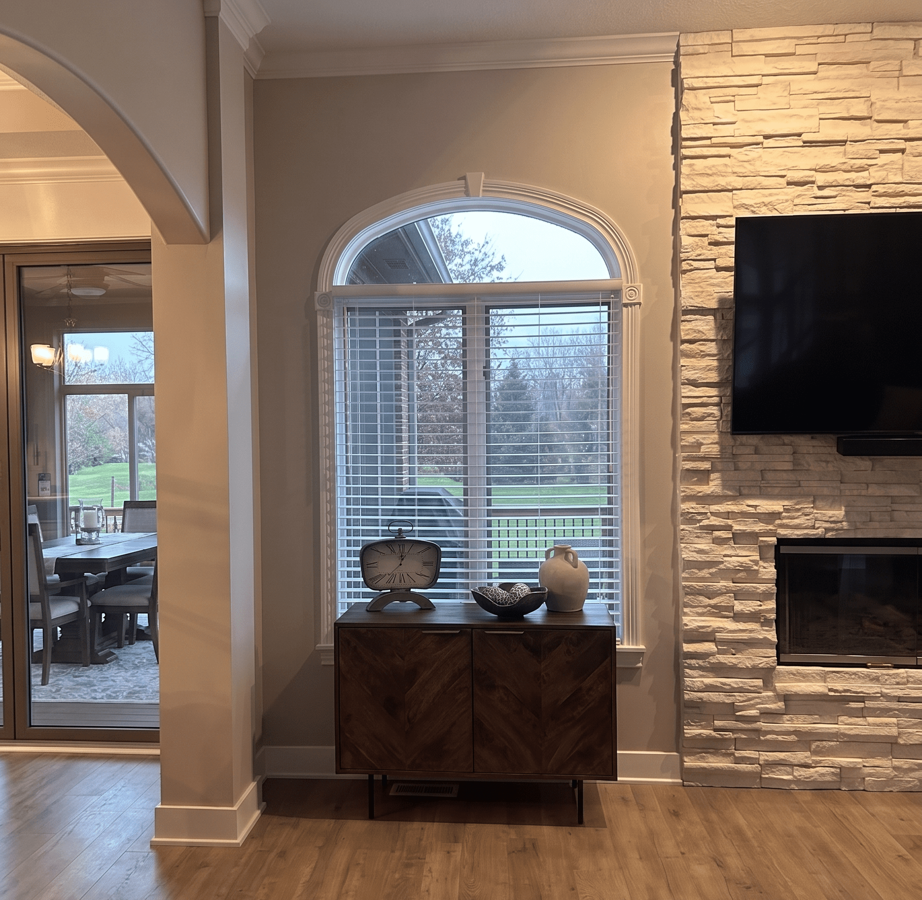 InStyle Blinds IN - a cozy living room nook has blinds on a unique window.